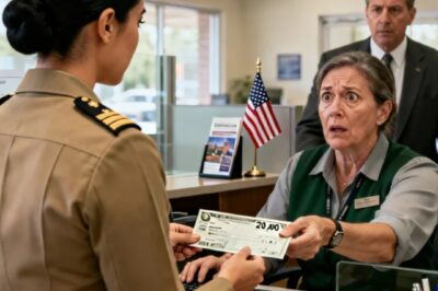 At our Veterans Day dinner, Dad handed each of us a $20,000 check. “Just a prop, “he laughed. “From an account that’s been closed for years.” My brother threw his into the fireplace. I was the only one who kept mine. When I took it to the bank, the teller went pale and said: “Ma’am, please…”